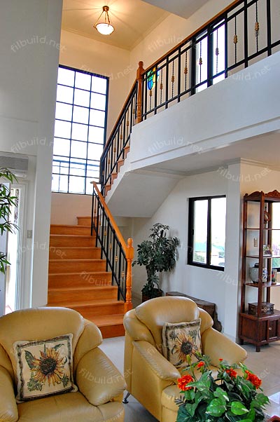 Stairs near main door for easy access to second floor.